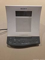 Front view showing Sony branding, display, speaker grille and control panel
