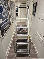 Front view showing four steps and handrail