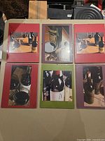 Overall view of six framed wine photos laid out