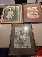 All three framed prints on table