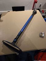 Full view of telescoping snow brush