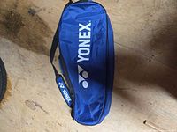 Top view of blue Yonex tennis bag showing logo