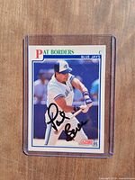 Front of signed Pat Borders card in sleeve