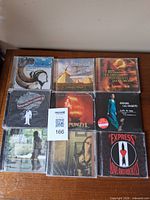 Front view of eight jewel-case CDs