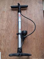 Full view of CCM floor pump showing hose, gauge, handle and base