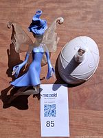 Fairy figurine with wings and separate white oval base