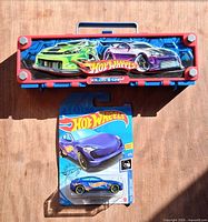 Carrying case with lid art and sealed car blister