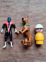 All three figures front view on wood surface