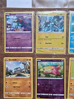 Binder page with Dreepy, Luxray, Geodude, Galarian Slowpoke in sleeves