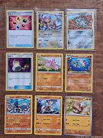Front view of all nine Pokémon cards in binder page