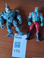 Both action figures side by side on tabletop