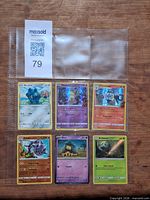 All six Pokémon cards in binder sleeve