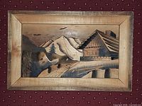 Front view of carved wood relief with frame
