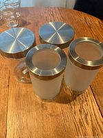 Top view showing four jars, lid style and glass types