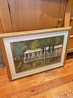 Front view of framed painting showing artwork, matting and frame
