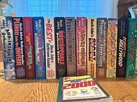 Sixteen Bathroom Reader spines plus bonus booklet