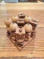 assembled wooden stacking puzzle viewed from top front