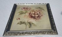 Front view of framed floral painting on canvas