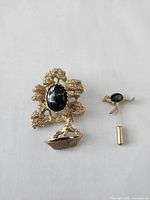 Bonsai brooch and kangaroo stick pin full view