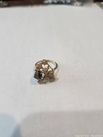 Front view of the gold plated tiger's eye cluster ring
