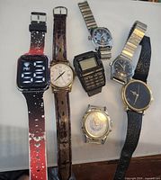 Front view of all six watches displaying dials and straps