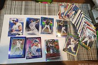 Group shot of all cards including featured holos and stack