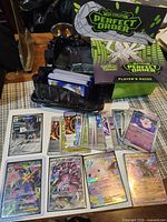 Overview showing Perfect Order box, player’s guide, deck tray with sleeved cards, and spread of feature cards
