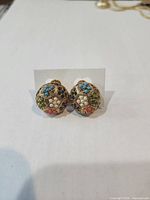 Front view of both earrings showing multicolour stones and faux pearls