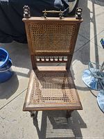 Full view of oak caned side chair