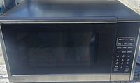 Front view of Vissani microwave showing door, control panel and exterior condition