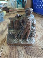 Front view showing soldier, building scene and title text