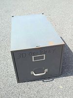 Front view showing single drawer, label holder, pull handle, marker writing