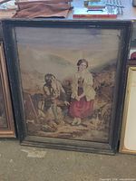Full view of framed needlepoint tapestry