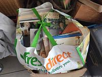 Bag containing stack of assorted books