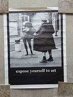 Full view of the unframed poster taped to wall