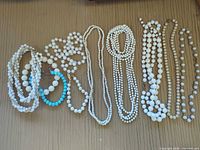 Entire group of necklaces and bracelets laid out for overview