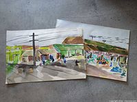 Both paintings overlapped on concrete surface