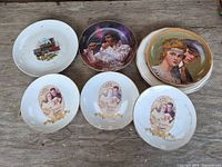 Six visible plates: Elvis, train, three Whitman’s, Rockwell on stack