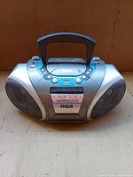 Front view showing speakers, cassette deck and control panel