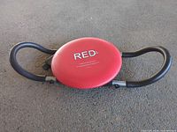 Full view of RED Fitness ab twister showing red seat and black handles