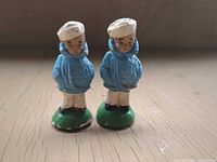 Full view of both sailor boy shakers standing