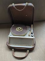 Overall view of Steelman suitcase record player open in its carrying case