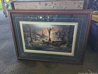 Full view of framed Terry Redlin print resting against surface