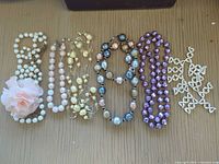 All six necklaces laid out side by side