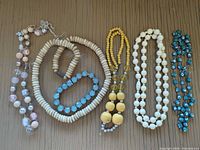 Group shot of six jewelry pieces laid out