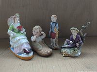 Group shot of all four porcelain figurines