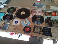 Wide view of all LPs, 45s and 78s laid out on table