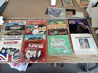 Overview of assorted LP and 45 rpm records laid out on table