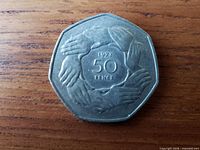 Reverse with nine clasped hands and 1973 50 PENCE legend