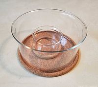 Large and small Bodum glass bowls on their cork bases